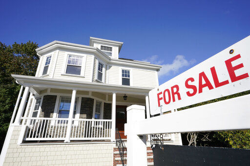 U.S. long-term mortgage rates changed little this week. PHOTO CREDIT: Steven Senne