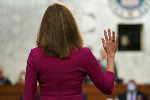 Supreme Court nominee Amy Coney Barrett is sworn in for her confirmation hearing before the Senate Judiciary Committee, Monday, Oct. 12, 2020, on Capitol Hill in Washington. (Greg Nash/Pool via AP) PHOTO CREDIT: Greg Nash