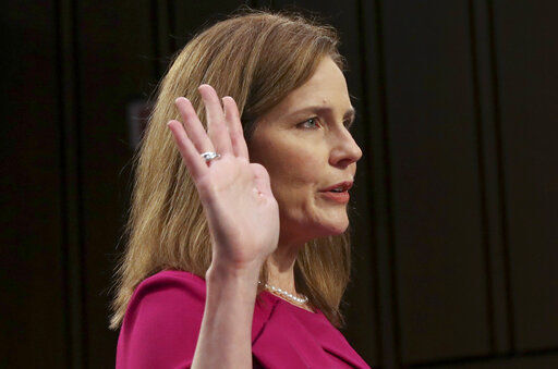 Supreme Court nominee Amy Coney Barrett is sworn in for her confirmation hearing before the Senate Judiciary Committee, Monday, Oct. 12, 2020, on Capitol Hill in Washington. (Leah Millis/Pool via AP) PHOTO CREDIT: Leah Millis