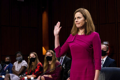 Supreme Court nominee Amy Coney Barrett is sworn in Monday during her Senate Judiciary Committee confirmation hearing on Capitol Hill in Washington. PHOTO CREDIT: Erin Schaff