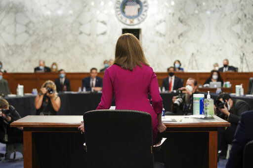 Supreme Court nominee Amy Coney Barrett arrives for her Senate Judiciary Committee confirmation hearing before the Senate Judiciary Committee on Capitol Hill in Washington, Monday, Oct. 12, 2020. (Greg Nash/Pool via AP) PHOTO CREDIT: Greg Nash