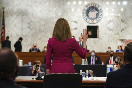 Supreme Court nominee Amy Coney Barrett is sworn in for her confirmation hearing before the Senate Judiciary Committee, Monday, Oct. 12, 2020, on Capitol Hill in Washington. (Greg Nash/Pool via AP) PHOTO CREDIT: Greg Nash