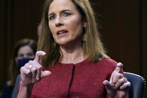 Supreme Court nominee Amy Coney Barrett speaks during the second day of her confirmation hearing before the Senate Judiciary Committee on Capitol Hill. Barrett is vowing to bring no "agenda” to the court, batting back senators