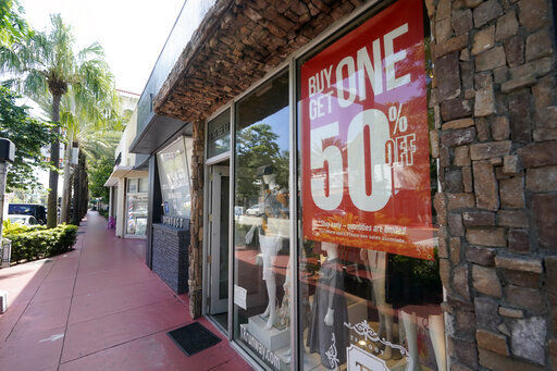 A business displays a "Buy One Get One 50% Off," sign Monday, Oct. 12, 2020, in Surfside, Fla. U.S. consumer prices rose slightly in September, led again by sharp increases in the index for used vehicles. The Labor Department reported Tuesday, Oct. 13 that the consumer price index rose 0.2% last month. (AP Photo/Wilfredo Lee) PHOTO CREDIT: Wilfredo Lee