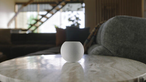 This image provided by Apple shows the new HomePod Mini that Apple unveiled Tuesday, Oct. 13, 2020. The new HomePod Mini will cost almost $100. It will integrate Apple