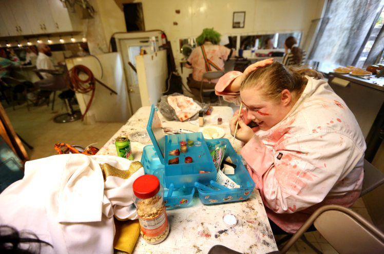 Katie Vondra applies makeup while getting into character at Dark Chambers in Hazel Green, Wis. PHOTO CREDIT: JESSICA REILLY