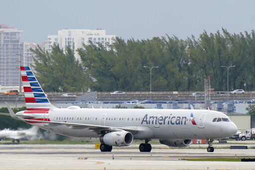 An American Airlines Airbus A321-231 taxies to the gate, Tuesday, Oct. 20, 2020, at Fort Lauderdale-Hollywood International Airport in Fort Lauderdale, Fla. Airlines are continuing to pile up billions of dollars in losses as the pandemic causes a massive drop in air travel. American Airlines said Thursday, Oct. 22, that it lost $2.4 billion in the normally strong third quarter, which includes most of the summer vacation season. (AP Photo/Wilfredo Lee) PHOTO CREDIT: Wilfredo Lee