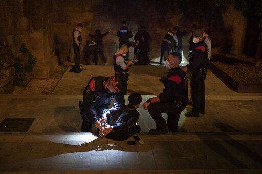 People are detained and inspected by Mossos D
