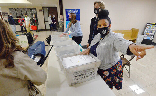 Marian Collin Franco, 20, helps collect provisional ballots at the Erie County Courthouse on Election Day, Tuesday, Nov. 3, 2020, in Erie, Pa. (Greg Wohlford/Erie Times-News via AP) PHOTO CREDIT: Greg Wohlford