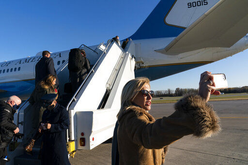 Fox News host Laura Ingraham takes a picture before boarding Air Force One to accompany President Donald Trump in Wisconsin. Two of Fox News Channel