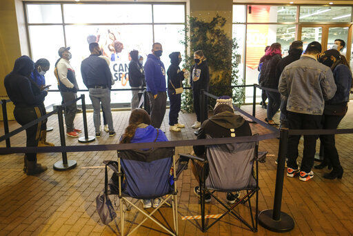 Black Friday shoppers wait in line to enter an shore that opened at 6am at the Citadel Outlets in Commerce, Calif., Friday, Nov. 27, 2020. (AP Photo/Ringo H.W. Chiu) PHOTO CREDIT: Ringo H.W. Chiu