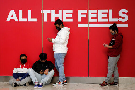 Black Friday shoppers wearing face masks wait in line to enter a store at the Glendale Galleria in Glendale, Calif., Friday, Nov. 27, 2020. (AP Photo/Ringo H.W. Chiu) PHOTO CREDIT: Ringo H.W. Chiu