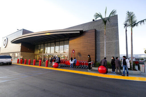 A few Black Friday shoppers wait in line to enter a Target store that opened at 7am in Commerce, Calif., Friday, Nov. 27, 2020. (AP Photo/Ringo H.W. Chiu) PHOTO CREDIT: Ringo H.W. Chiu
