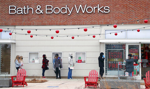 A socially distanced line of customers wait to shop at Bath & Body Works during Black Friday shopping outdoors at Deer Park Town Center Friday, Nov. 27, 2020, in Deer Park, Ill. (Brian Hill/Daily Herald via AP) PHOTO CREDIT: Brian Hill