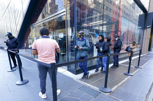 Black Friday shoppers wait in line to enter the Nike store along Fifth Avenue, Friday, Nov. 27, 2020, in New York. (AP Photo/Mary Altaffer) PHOTO CREDIT: Mary Altaffer