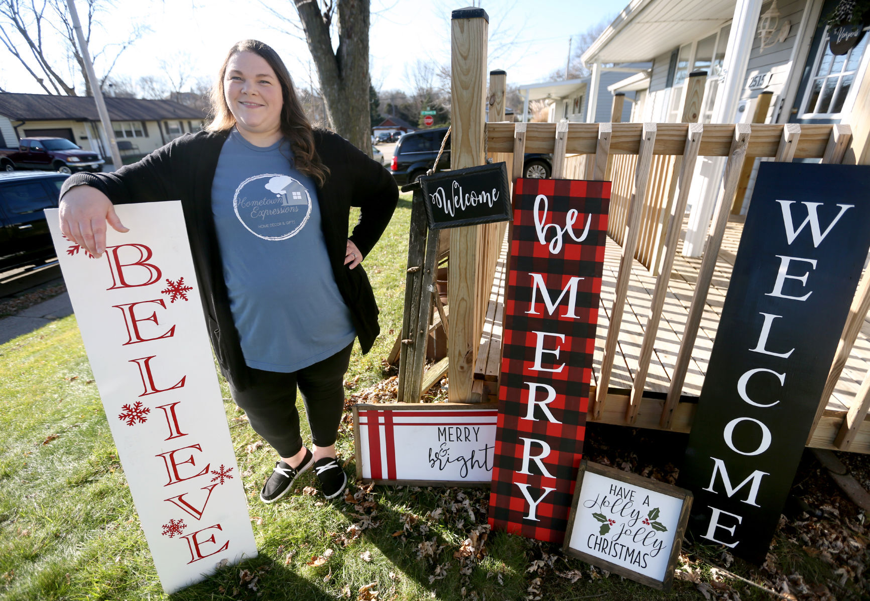 Amy Kempen, owner of Hometown Expressions, shows off some designs outside her home in Dubuque on Friday, Nov. 27, 2020. PHOTO CREDIT: JESSICA REILLY