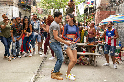 This image released by Warner Bros. Picures shows a scene from the upcoming film "In the Heights." Warner Bos. Pictures on Thursday announced that all of its 2021 film slate — including a new “Matrix” movie, “Godzilla vs. Kong” and the Lin-Manuel Miranda adaptation “In the Heights” — will stream on HBO Max at the same time they play in theaters. (Macall Polay/Warner Bros. Entertainment via AP) PHOTO CREDIT: Macall Polay