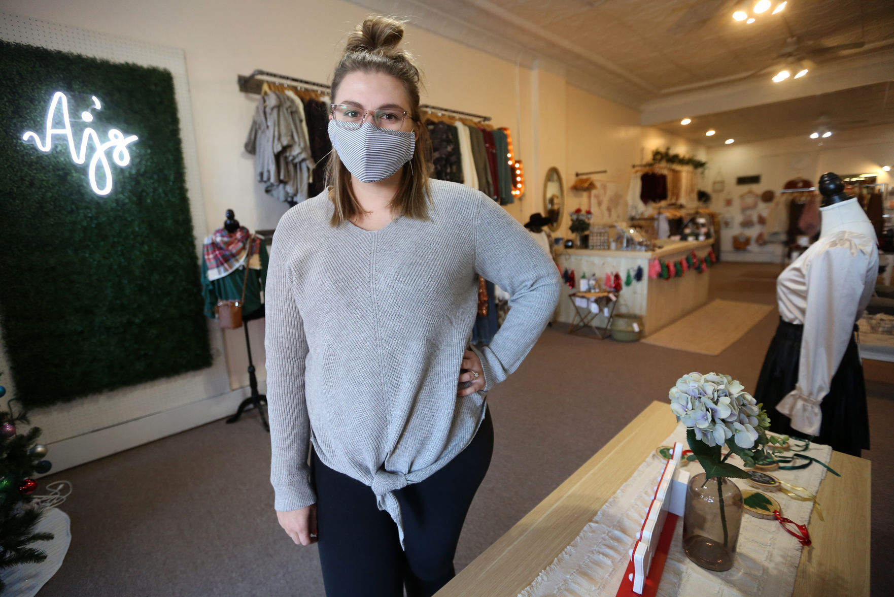 Amanda Kaiser owns AJ’s Boutique at 129 Main St. in Dubuque. The new business sells dresses, shirts, sweaters, pants and a wide variety of accessories geared toward women, in sizes ranging from extra small to 3XL. PHOTO CREDIT: JESSICA REILLY