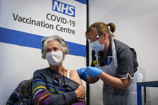 Dr Doreen Brown, 85, receives the first of two Pfizer/BioNTech COVID-19 vaccine jabs administered at Guy
