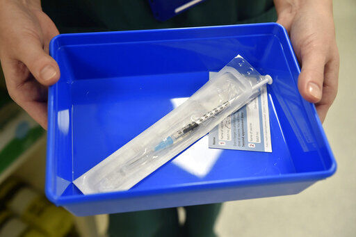 The Pfizer-BioNTech COVID-19 vaccine at a vaccination centre in Cardiff, Wales, Tuesday Dec. 8, 2020. The United Kingdom, one of the countries hardest hit by the coronavirus, is beginning its vaccination campaign, a key step toward eventually ending the pandemic. (Ben Birchall/Pool via AP) PHOTO CREDIT: Ben Birchall