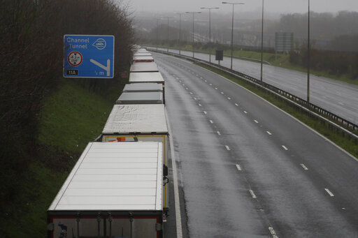 Lorries parked on the M20 near Folkestone, England, Monday, Dec. 21, 2020, as part of Operation Stack after the Port of Dover was closed and access to the Eurotunnel terminal suspended following the French government
