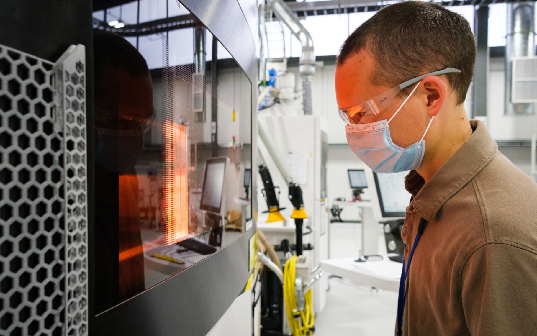 General Motors Manufacturing Engineer Benjamin LeBlanc inspects a 3D printer at the General Motors Additive Industrialization Center at the GM Tech Center in Warren, Mich. PHOTO CREDIT: Tribune News Service