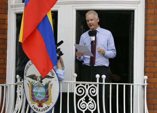 FILE - In this Sunday, Aug. 19, 2012 file photo, Julian Assange, founder of WikiLeaks makes a statement from a balcony of the Equador Embassy in London. Judge Vanessa Baraitser has ruled that Julian Assange cannot be extradited to the US. because of concerns about his mental health, it was reported on Monday, Jan. 4, 2021. Assange had been charged under the US