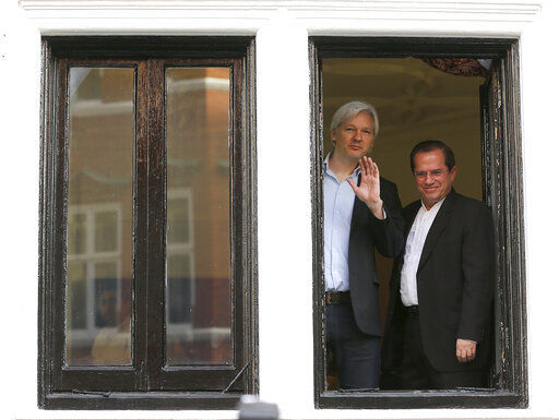 FILE - In this Sunday, June 16, 2013 file photo, WikiLeaks founder Julian Assange, left, appears with Ecuador