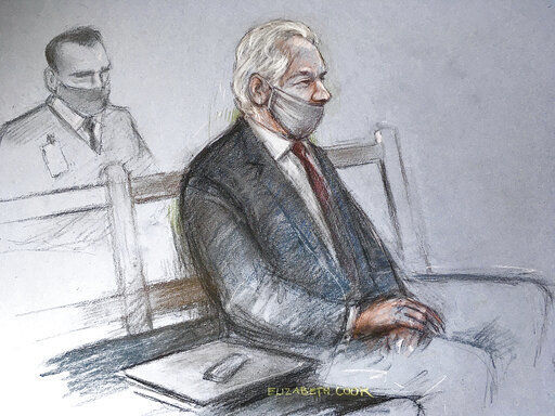 This is a court artist sketch by Elizabeth Cook of Julian Assange appearing at the Old Bailey in London for the ruling in his extradition case, in London, Monday, Jan. 4, 2021. A British judge has rejected the United States’ request to extradite WikiLeaks founder Julian Assange to face espionage charges, saying it would be “oppressive” because of his mental health. District Judge Vanessa Baraitser said Assange was likely to kill himself if sent to the U.S. The U.S. government said it would appeal the decision. (Elizabeth Cook/PA via AP) PHOTO CREDIT: Elizabeth Cook