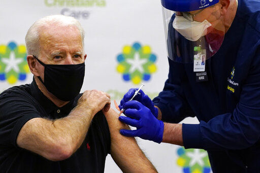 President-elect Joe Biden receives his second dose of the coronavirus vaccine at ChristianaCare Christiana Hospital in Newark, Del., Monday, Jan. 11, 2021. The vaccine is being administered by Chief Nurse Executive Ric Cuming. (AP Photo/Susan Walsh) PHOTO CREDIT: Susan Walsh