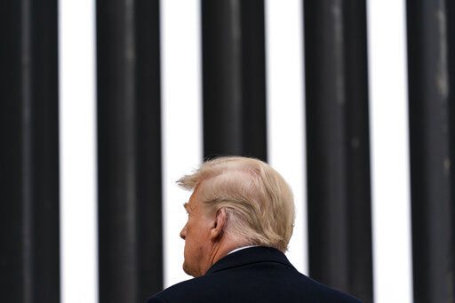 President Donald Trump tours a section of the U.S.-Mexico border wall. The wall of Republican support that has enabled Trump to weather a seemingly endless series of crises is beginning to erode. PHOTO CREDIT: Alex Brandon