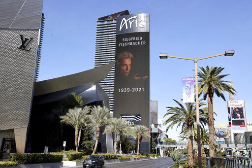The late Siegfried Fischbacher of the legendary illusion team Siegfried & Roy is memorialized on the Aria marquee on the Strip in Las Vegas, Thursday, Jan. 14, 2021. Fischbacher, namesake partner in the iconic entertainment duo Siegfried & Roy, has died in Las Vegas at age 81. Fischbacher died Wednesday at his home from pancreatic cancer, said publicist Dave Kirvin of Kirvin Doak Communications. (K.M. Cannon/Las Vegas Review-Journal via AP) PHOTO CREDIT: K.M. Cannon