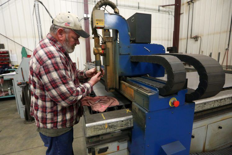 Jim Ingles prepares a CNC plasma cutter for a job at T&J Manufacturing in Maquoketa, Iowa.    PHOTO CREDIT: NICKI KOHL
