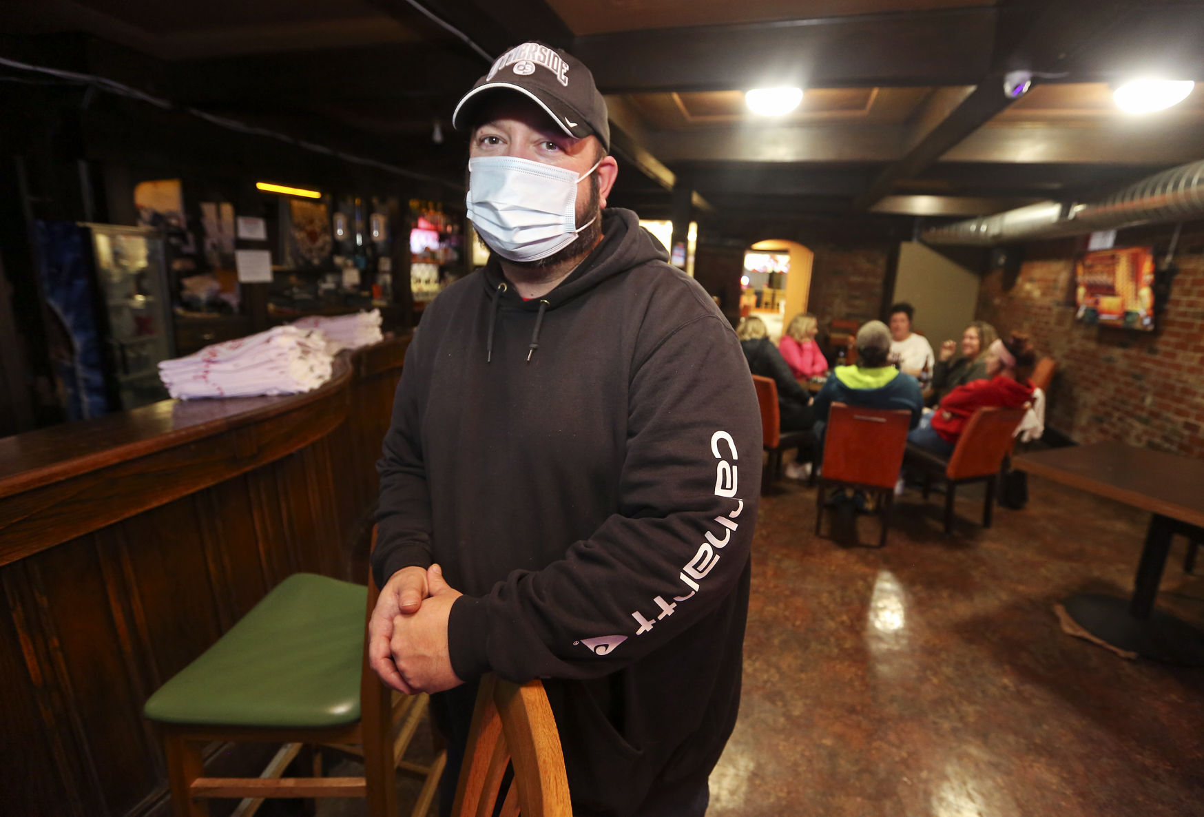 Mike Meyer, owner of the The Other Side in East Dubuque, Ill., on Tuesday, Jan. 19, 2021. Jo Daviess County has moved to Tier 1 mitigation, allowing for indoor dining and small gatherings. PHOTO CREDIT: NICKI KOHL