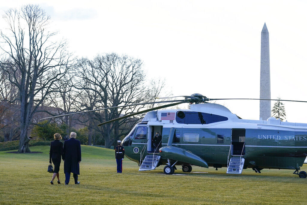 President Donald Trump and first lady Melania Trump walk to board Marine One on the South Lawn of the White House today in Washington. Trump is leaving Washington just hours before Joe Biden takes the oath of office as the 46th president. PHOTO CREDIT: Alex Brandon
