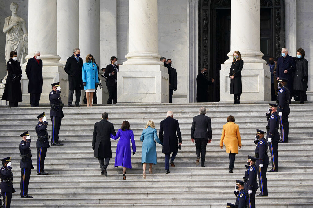 President-elect Joe Biden, his wife Jill Biden and Vice President-elect Kamala Harris and her husband Doug Emhoff arrive at the steps of the U.S. Capitol for the start of the official inauguration ceremonies, in Washington. PHOTO CREDIT: J. Scott Applewhite