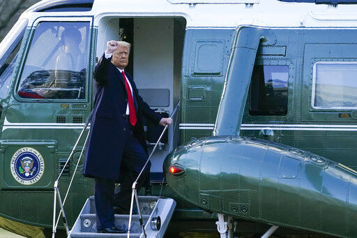 President Donald Trump gestures as he boards Marine One on the South Lawn of the White House, Wednesday, Jan. 20, 2021, in Washington. Trump is en route to his Mar-a-Lago Florida Resort. (AP Photo/Alex Brandon) PHOTO CREDIT: Alex Brandon