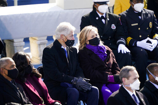 Former President Barack Obama and his wife Michelle and former President Bill Clinton and former Secretary of State Hillary Clinton attend the 59th Presidential Inauguration at the U.S. Capitol in Washington, Wednesday, Jan. 20, 2021. (AP Photo/Carolyn Kaster) PHOTO CREDIT: Carolyn Kaster
