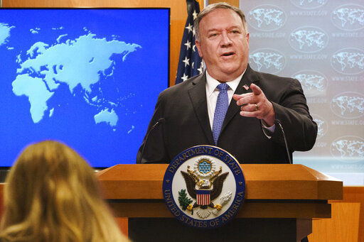 FILE - In this Nov. 10, 2020, file photo, Secretary of State Mike Pompeo gestures toward a reporter while speaking at the State Department in Washington. Pompeo plans to deliver a speech extolling the Trump administration