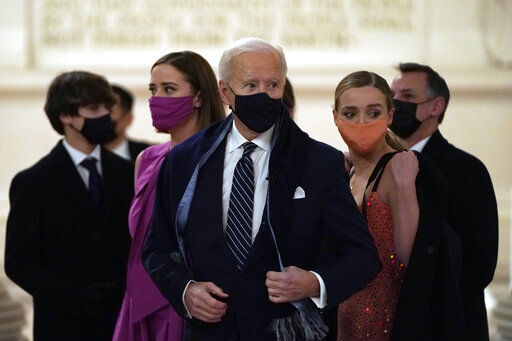 President Joe Biden is putting forth a national COVID-19 strategy to ramp up vaccinations and testing, reopen schools and businesses and increase the use of masks — including a requirement that they be worn for travel. PHOTO CREDIT: Joshua Roberts