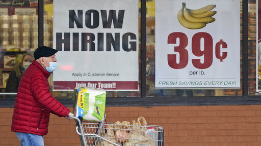 Fewer Americans applied for unemployment benefits last week, but remained at historic highs. PHOTO CREDIT: Tony Dejak