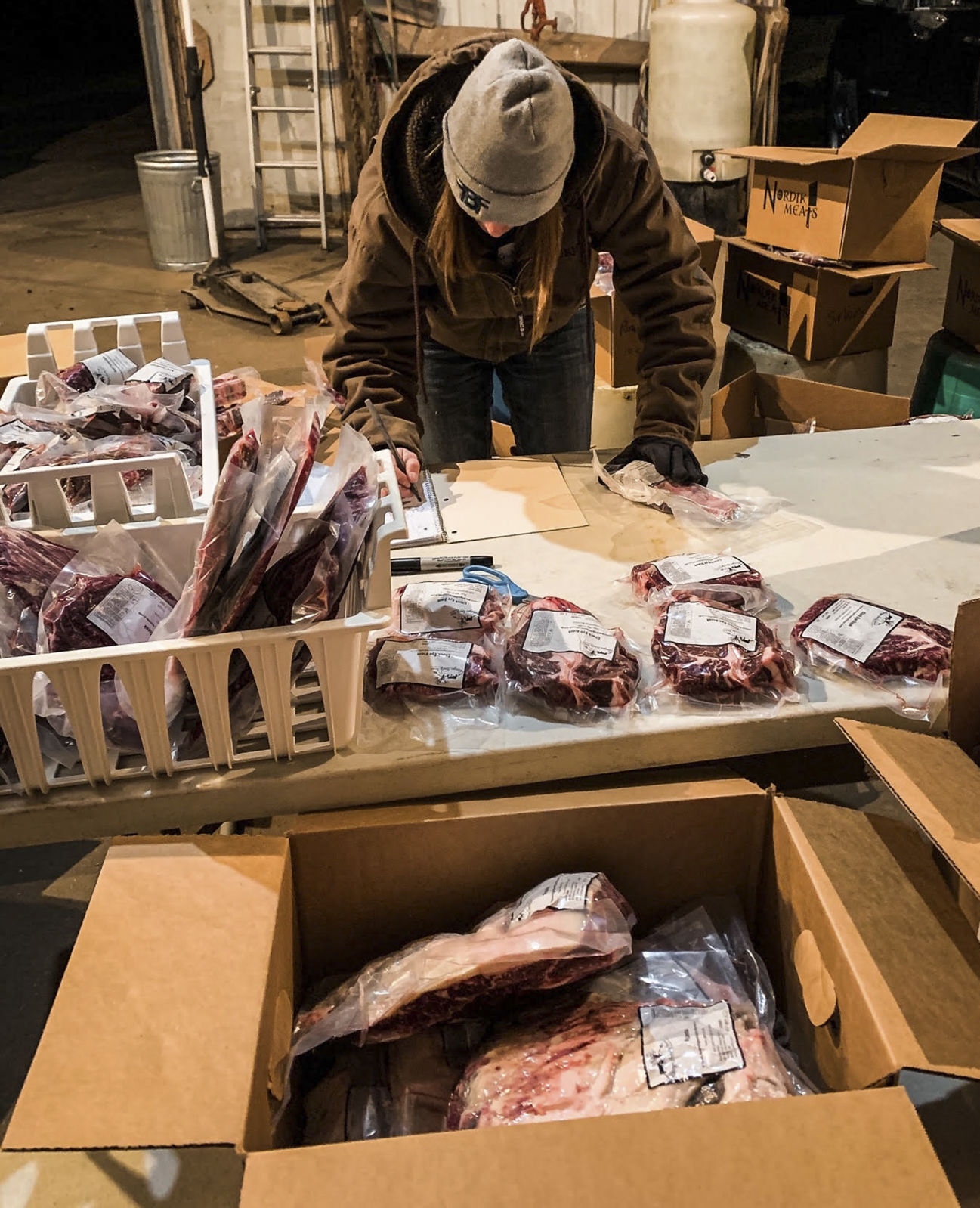 Lillie Beringer prepares a shipment of Angus beef cuts. PHOTO CREDIT: Contributed