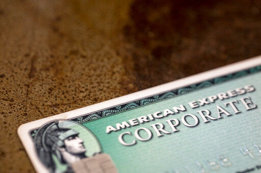 American Express said its fourth-quarter profits dropped by 15% from a year ago, as the global pandemic kept cardmembers from dining out, traveling and entertaining. The New York-based company said it earned a profit of $1.42 billion, or $1.76 per share, down from a profit of $1.69 billion, or $2.03 a share, in the same period a year earlier. PHOTO CREDIT: Jenny Kane
