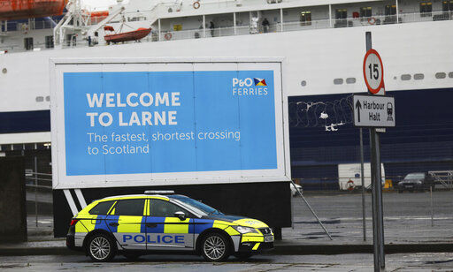 Police patrol the port of Larne, Northern Ireland, Tuesday, Feb. 2, 2021. Authorities in Northern Ireland have suspended checks on animal products and withdrawn workers from two ports after threats against border staff. (AP Photo/Peter Morrison) PHOTO CREDIT: Peter Morrison