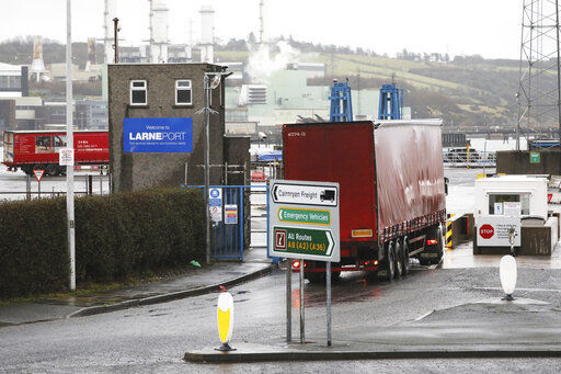 Vehicles at the port of Larne, Northern Ireland, Tuesday, Feb. 2, 2021. Authorities in Northern Ireland have suspended post-Brexit border checks on animal products and withdrawn workers after threats against border staff. (AP Photo/Peter Morrison) PHOTO CREDIT: Peter Morrison