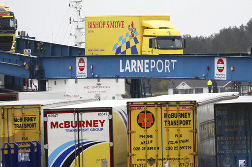 Vehicles disembark from the P&O ferry arriving from Scotland at the port of Larne, Northern Ireland, Tuesday, Feb. 2, 2021. Authorities in Northern Ireland have suspended checks on animal products and withdrawn workers from two ports after threats against border staff. (AP Photo/Peter Morrison) PHOTO CREDIT: Peter Morrison