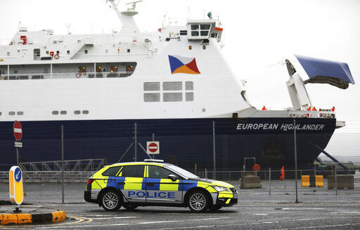 Police patrol the port of Larne, Northern Ireland, Tuesday, Feb. 2, 2021. Authorities in Northern Ireland have suspended checks on animal products and withdrawn workers from two ports after threats against border staff. (AP Photo/Peter Morrison) PHOTO CREDIT: Peter Morrison