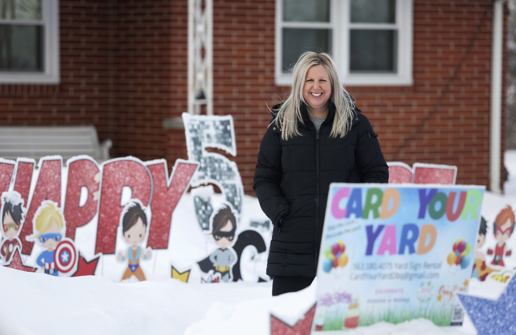 Jill Keck is the owner of Card Your Yard Dubuque. Photo taken a current display in Dubuque on Friday, Feb. 5, 2021. PHOTO CREDIT: NICKI KOHL