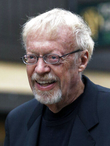 FILE - In this Thursday, July 11, 2013, file photo, Phil Knight, the co-founder and chairman of Nike, Inc., walks to the morning session at the Allen & Company Sun Valley Conference in Sun Valley, Idaho. Knight and his wife, Penelope, are among the 50 Americans who gave the most to charity in 2020, according to the Chronicle of Philanthropy’s annual rankings. (AP Photo/Rick Bowmer, File) PHOTO CREDIT: Rick Bowmer