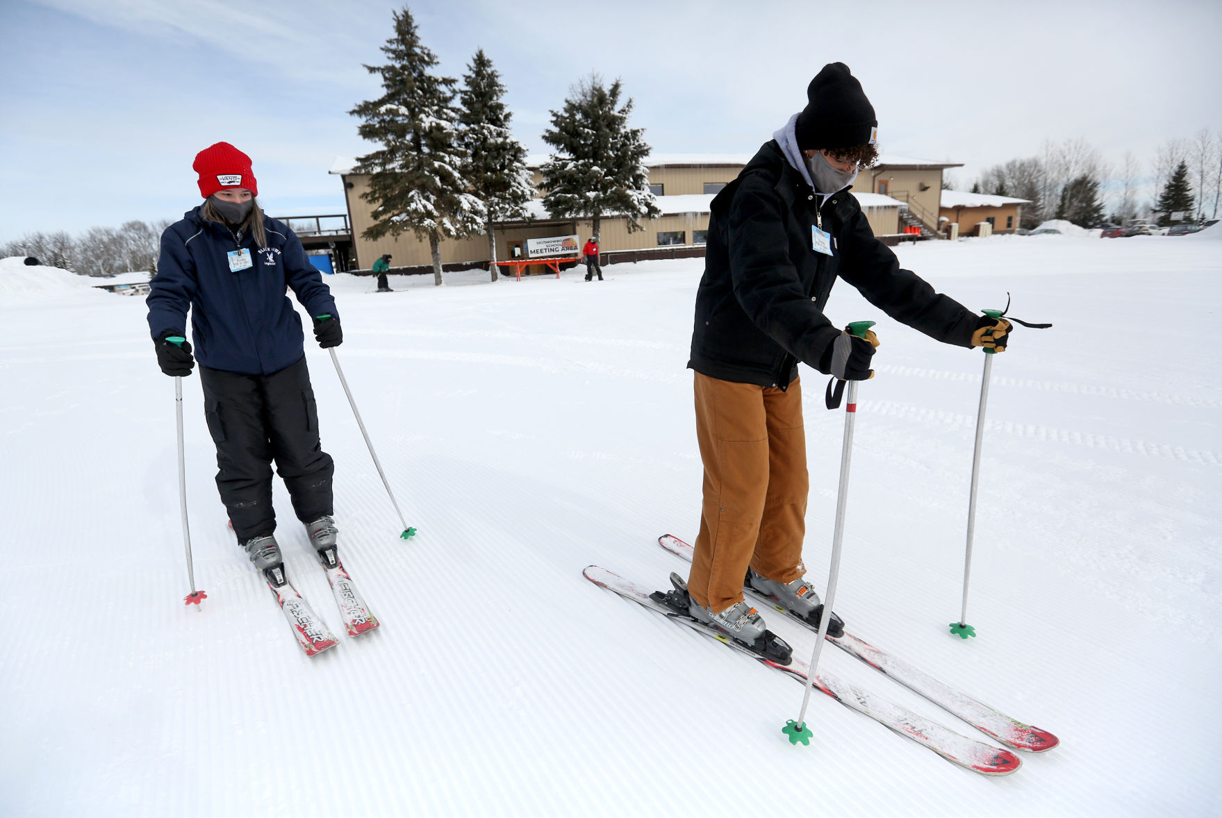 Sedina Covic (left), 18, and Madison McCarvel, 19, both of Waterloo, Iowa, ski at Sundown on Sunday. PHOTO CREDIT: JESSICA REILLY